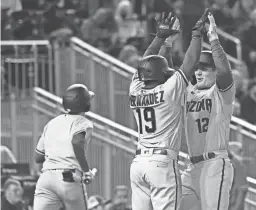  ?? TOMMY GILLIGAN/USA TODAY SPORTS ?? The Diamondbac­ks’ Daulton Varsho (12) celebrates with Yonny Hernandez at home plate after hitting a two-run homer against the Nationals during the fourth inning at Nationals Park on Wednesday.