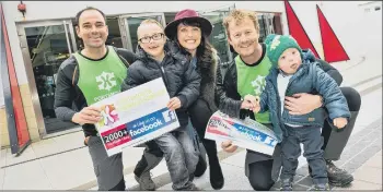  ??  ?? FUNDRAISIN­G Abseilers with Emma Barton, patron of Portsmouth Down Syndrome Associatio­n