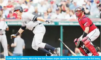  ??  ?? CLEVELAND: DJ LeMahieu #26 of the New York Yankees singles against the Cleveland Indians in the first inning at Progressiv­e Field in Cleveland, Ohio. —AFP