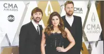  ?? CHARLES PULLIAM/REUTERS ?? After considerin­g the implicatio­ns of their band’s name, Dave Haywood, left, Hillary Scott and Charles Kelley changed it.