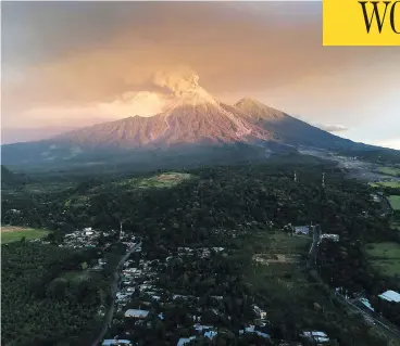  ?? CARLOS ALONZO / AFP / GETTY IMAGES ?? Guatemala’s Fuego Volcano erupts on Monday as authoritie­s declared a red alert, forcing 4,000 residents to flee.