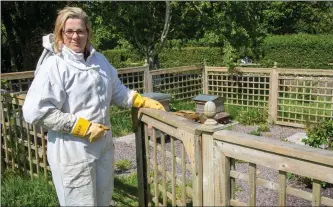  ?? Mags Moriarty at her apiary, where she made the grim discovery. Photo by Joe Hanley. ??