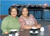  ?? Picture: FREDLIN ADRIAAN ?? ACOUSTIC EVENING: Ntombomzi Mtwebana, left, and Irene Gazi enjoy coffee at Shisa African Restaurant during Dumza Maswana’s ‘Xhosa Acoustic Tour’ on Wednesday night