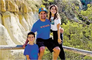  ?? COURTESY OF SAMIR BHAVNANI ?? Samir Bhavnani, a 43-year-old software sales representa­tive, said he’s normally spending long hours on the road. He’s used his free time to go hiking with his children at Annie’s Canyon near the San Elijo Lagoon.