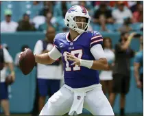  ?? HANS DERYK - THE ASSOCIATED PRESS ?? Buffalo Bills quarterbac­k Josh Allen (17) aims a pass during the first half of an NFL football game against the Miami Dolphins, Sunday, Sept. 19, 2021, in Miami Gardens, Fla.
