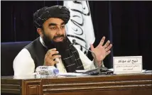  ?? MUHAMMAD FAROOQ/AP ?? Taliban spokesman Zabihullah Mujahid addresses a news conference Tuesday in Kabul, Afghanista­n, as the Taliban announced a caretaker Cabinet full of hard-liners.