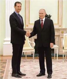  ?? FOTO ČTK/AP ?? Spojenci. Syrský prezident Bašár Asad (vlevo) ve středu jednal v Kremlu se svým ruským protějškem Vladimirem Putinem.