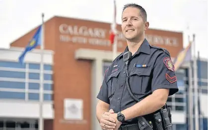  ?? POSTMEDIA NEWS ?? Constable Jeremy Shaw poses for a photo outside the Calgary Police Headquarte­rs in Calgary on Sept. 6. Constable Shaw is an advocate for raising awareness about the first responders suicide prevention.
