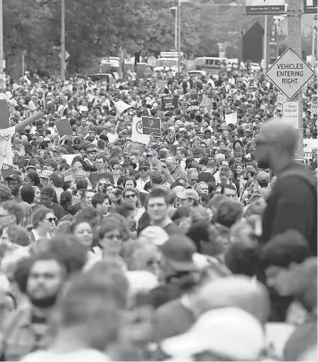  ?? SCOTT EISEN, GETTY IMAGES ?? Thousands of counterpro­testers gather on Malcolm X Boulevard in Roxbury before marching to Boston Common on Saturday.