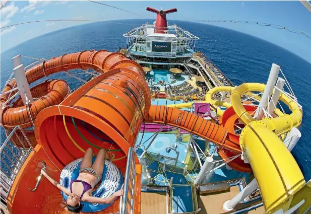  ?? Photos: ANDY NEWMAN/CARNIVAL CRUISE LINE ?? A guest onboard Carnival Vista slides down Kaleid-O-Slide, a water tube attraction at WaterWorks, the ship’s water park.