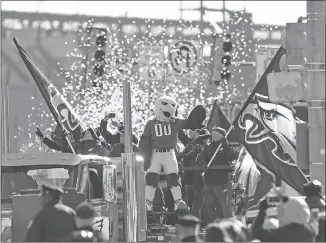  ?? AP PHOTO ?? Philadelph­ia Eagles mascot Swoop waves during the team’s Super Bowl LII victory parade Thursday. The city hasn’t planned to release any crowd size estimates but organizers prepared for as many as two million people to line the eight-kilometre parade...