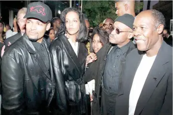  ?? — AFP file photo ?? In this file photo taken on May 2, 1995 the ‘Panther’ director and producer Mario Van Peebles (left) and his father Melvin (second right), who wrote the screenplay for the film which tells the story of the orgins of the Black Panther Party, arrive at the premiere the film in Beverly Hills, with Fredricka Newton (second left), the widow of Black Panther member Huey Newton, and David Hilliard (right), a former Black Panther leader.