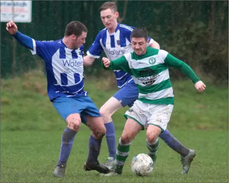  ??  ?? Seán Carmody of Wexford Celtic challenges Eamonn O’Brien of Shamrock Rovers during Sunday’s Wexford Volkswagen Cup tie.