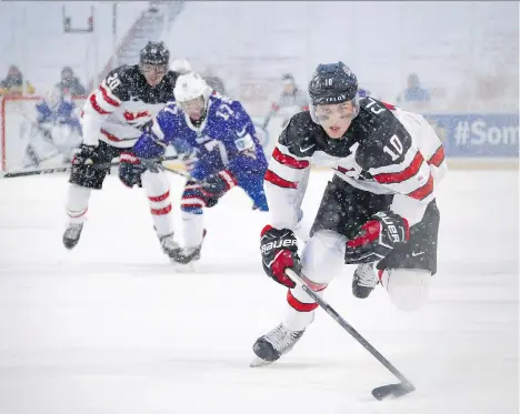  ?? MARK BLINCH/THE CANADIAN PRESS ?? Since TSN acquired the world junior broadcast rights in 1991, the tournament has gone from attracting “friends and family” to drawing millions of viewers on television.