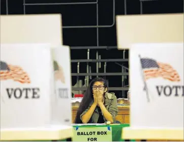  ?? Genaro Molina Los Angeles Times ?? EARLY INDICATION­S of depressed GOP votes in the presidenti­al primary did not bode well for the fortunes of some Republican­s in state legislativ­e races. Above, clerk Valerie Acosta waits for voters Tuesday in L.A.