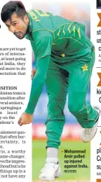 ?? REUTERS ?? Mohammad Amir pulled up injured against India.