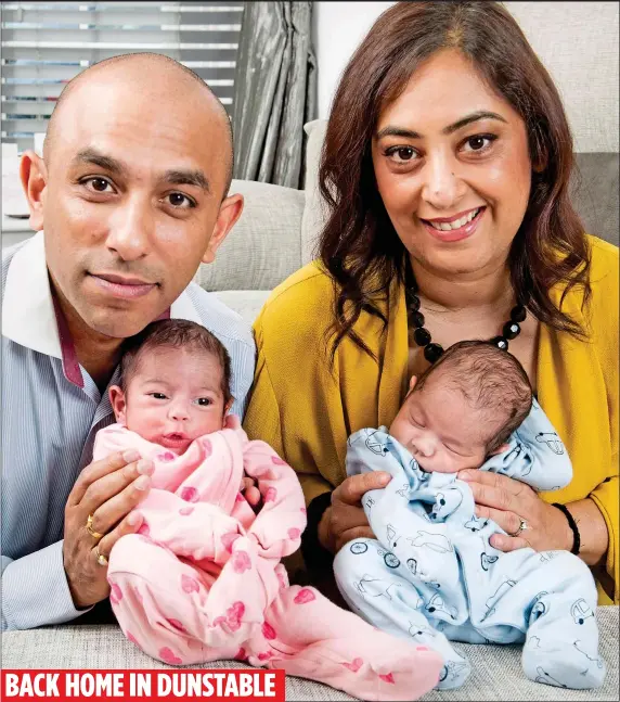  ?? ?? BACK HOME IN DUNSTABLE
HARROWING: Metaish and Manisha Parmar with their twins Amaya and
Sai, born via a surrogate in Ukraine
