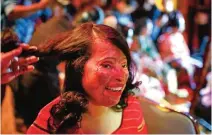  ??  ?? "In this photo, a Bangladesh­i acid attack survivor gets her make up applied during the event Beauty Redefined in Dhaka, Bangladesh.