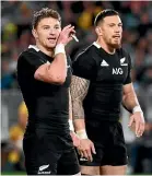  ??  ?? Beauden Barrett, left with Sonny Bill Williams, overcame severe stomach pains to play a full 80 minutes.
