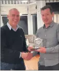  ?? ?? Club secretary Labhras Flynn making a presentati­on to John Horgan to acknowledg­e his AllIreland handball success at our recent medal presentati­on night.