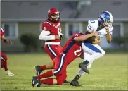  ??  ?? Wheatland High’s Tariq Parker is brought down by Lindhurst’s Simon Enochs during a game on Sept. 6 at Blazer Stadium in Olivehurst.