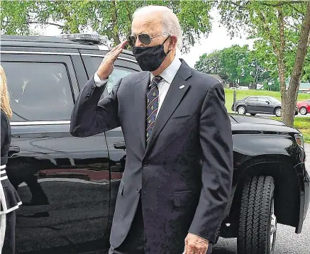  ?? PHOTO: AP ?? Brave face: Democratic presidenti­al candidate Joe Biden salutes veterans while walking with his wife Jill at the Delaware Memorial Bridge Veteran’s Memorial Park in Newcastle, Delaware.