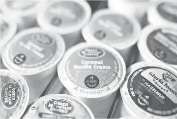  ??  ?? A tray of Keurig Green Mountain Inc. K-Cup coffee packs. Single-serve brewing machines popularise­d by Keurig are now used by more than one in four Americans and are altering the way coffee is consumed. — WP-Bloomberg photo