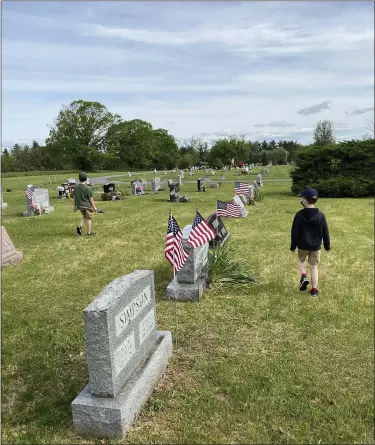  ?? SUBMITTED PHOTOS ?? Birdsboro American Legion Post 626placed more than 800flags on veteran graves at the Birdsboro Cemetery on May 16. While not an official Scout event, local scouts helped the Legion members place the flags.