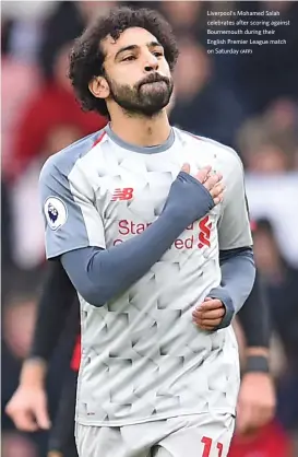  ?? (AFP) ?? Liverpool's Mohamed Salah celebrates after scoring against Bournemout­h during their English Premier League match on Saturday