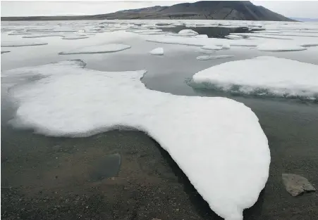  ?? JEFF McINTOSH, THE CANADIAN PRESS ?? Ice floats in Slidre Fjord outside the Eureka Weather Station on Ellesmere Island, Nunavut, in July 2006. New research finds that hundreds of glaciers in Canada’s High Arctic are shrinking and that many are likely fated to disappear.