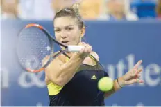  ?? — USA Today Sports ?? Simona Halep (ROU) returns a shot against Johanna Konta (GBR) during the Cincinnati Masters WTA tournament.