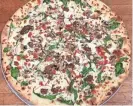  ?? TAYLOR SMYTHE ?? Bill’s Pizza in Prescott offers a wide-ranging menu that features nearly two-dozen specialty pizzas built on a sourdough crust.