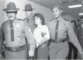  ?? HANDSCHUH/AP 1981 ?? Katherine Boudin is led by sheriff’s officers from Rockland County Courthouse in New City, N.Y.