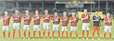  ??  ?? READY FOR THE TEST: Sarawak team lining up before playing at home against SPA Putrajaya FC last Friday. The Crocs are trailing league leader Sime Darby FC by only two points. — Photo by Chimon Upon.