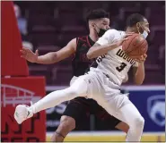  ?? MEDIANEWS GROUP PHOTO ?? Archbishop Wood’s Rahsool Diggins (3) and Reading High’s Joey Chapman (5) battle for position in the PIAA 6A Boys Basketball State Championsh­ip Game at Hershey. Diggins was named the 6A Player of the Year on Saturday.