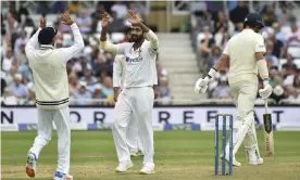  ?? Photograph: Rui Vieira/AP ?? India’s Jasprit Bumrah, centre, celebrates the dismissal of England’s Stuart Broad, right, as England’s batting order capitulate­d on the opening day at Trent Bridge.