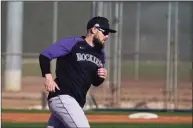  ?? Jae C. Hong / Associated Press ?? The Colorado Rockies’ Chris Owings trains during the team’s spring training workout on Wednesday in Scottsdale, Ariz.