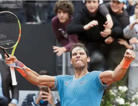  ??  ?? Flexing his muscles: Rafael Nadal of Spain celebrates after defeating Stefanos Tsitsipas of Greece during the semi-finals of the Italian Open in Rome on Saturday. Nadal won 6-3, 6-4. – AP