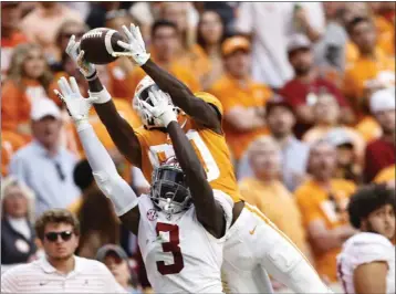  ?? WADE PAYNE – THE ASSOCIATED PRESS ?? Tennessee wide receiver Ramel Keyton goes up for a catch over Alabama defensive back Terrion Arnold on Saturday.