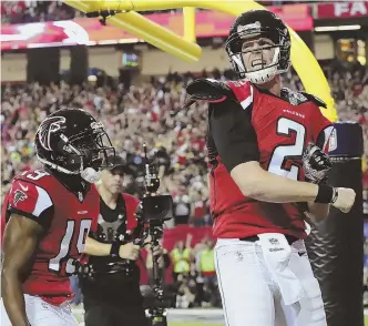  ?? AP PHOTOS ?? HOUSTON-BOUND: Matt Ryan (above) celebrates a touchdown during the Falcons’ big win over Aaron Rodgers (below) and the Packers yesterday in Atlanta.