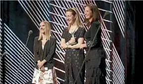  ?? SUPPLIED ?? Fairfax Media’s Emma Barrett, Chloe Stevenson and Annamarie Jamieson receiving the Attitude Award on Thursday night.