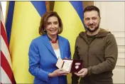  ?? UKRAINIAN PRESIDENTI­AL PRESS OFFICE VIA AP ?? Ukrainian President Volodymyr Zelenskyy, right, awards the Order of Princess Olga, the third grade, to U.S. Speaker of the House Nancy Pelosi in Kyiv, Ukraine, Saturday.