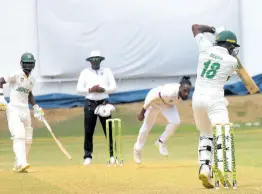  ?? PHOTO BY LENNOX ALDRED ?? Jamaica Scorpions opener Carlos Brown plays a backfoot punch off the bowling of Leeward Islands pacer Jeremiah Louis during the opening day of their West Indies Championsh­ip match at Sabina Park yesterday.