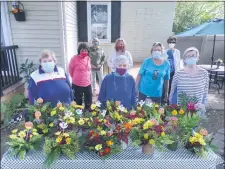  ?? SUBMITTED PHOTO ?? Pictured making floral arrangemen­ts to lift the spirits of residents at Sterling Healthcare and Rehabilita­tion Center in Media are Garden Club of Springfiel­d members, left to right, front, Jane Nyiri of Springfiel­d, Marion Nelson of Springfiel­d, Lynn Walton of Wallingfor­d, back, Judy Moore of Springfiel­d, Maryann DeSanto of Springfiel­d, Trisha Dougherty Lambert of Springfiel­d, Karen Giacomucci of Prospect Park and Louise Sheehan of Springfiel­d.