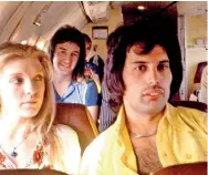  ??  ?? Queen guitarist Brian May will publish incredible unseen 3-D photograph­s, taken while on the film set of Bohemian Rhapsody, a year after the original book. Pictured: An unseen photo of John Deacon (rear) and Freddie Mercury (right) on a private jet are just one of the many rare photos included in the book