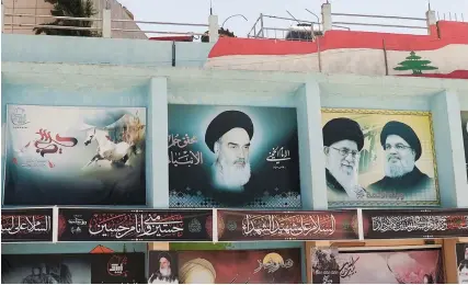  ?? (Issam Abdallah/Reuters) ?? BANNERS DEPICT (left to right) Iran’s late leader Ayatollah Ruhollah Khomeini, current Supreme Leader Ayatollah Ali Khamenei and Hezbollah leader Hassan Nasrallah, in Yaroun, southern Lebanon.