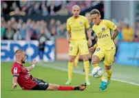  ?? Reuters ?? PSG’s Neymar evades a tackle from a Guingamp player. —