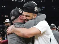  ?? (AP photo/ashley Landis) ?? Denver Nuggets guard Jamal Murray, right, is hugged by head coach Michael Malone Monday after Game 4 of the NBA basketball Western Conference Final series against the Los Angeles Lakers in Los Angeles.