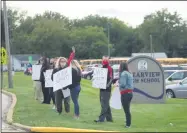  ?? LYRIC AQUINO — THE MORNING JOURNAL ?? Community members from Elyria school district and other supporters of Superinten­dent Jerome Davis protest on Sept. 14before the Clearview board of education meeting.