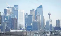  ?? THE CANADIAN PRESS FILES ?? Steam rises from buildings in Calgary, Alta. If a group of First Nations get their wish, Calgary will be renamed Wichispa Oyade, Stoney Nakoda terms that roughly translate to mean “elbow town.”